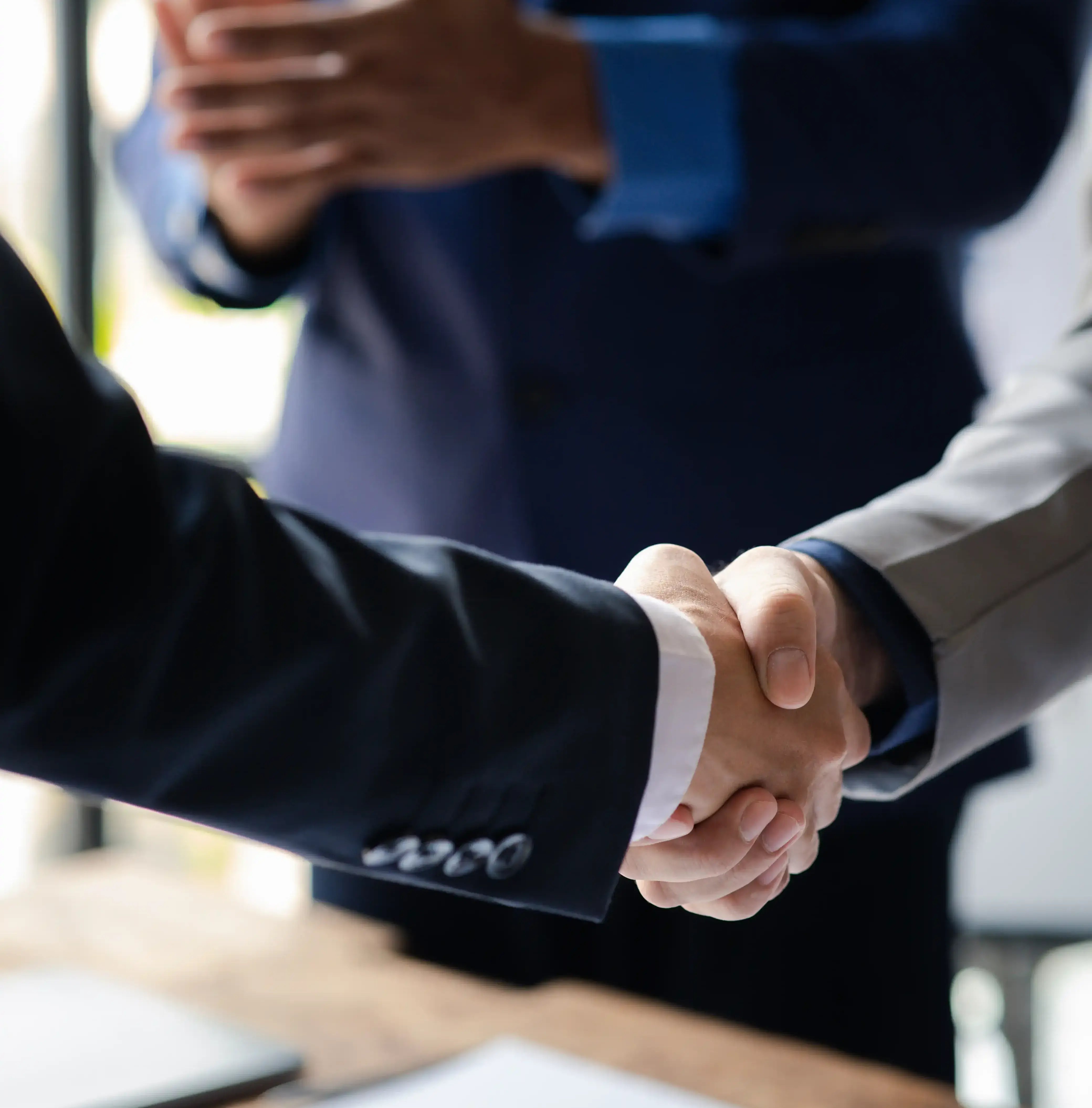 close-up-two-business-men-holding-hands-two-busin-2025-01-16-22-48-42-utc-1 close-up-two-business-men-holding-hands-two-busin-2025-01-16-22-48-42-utc-1