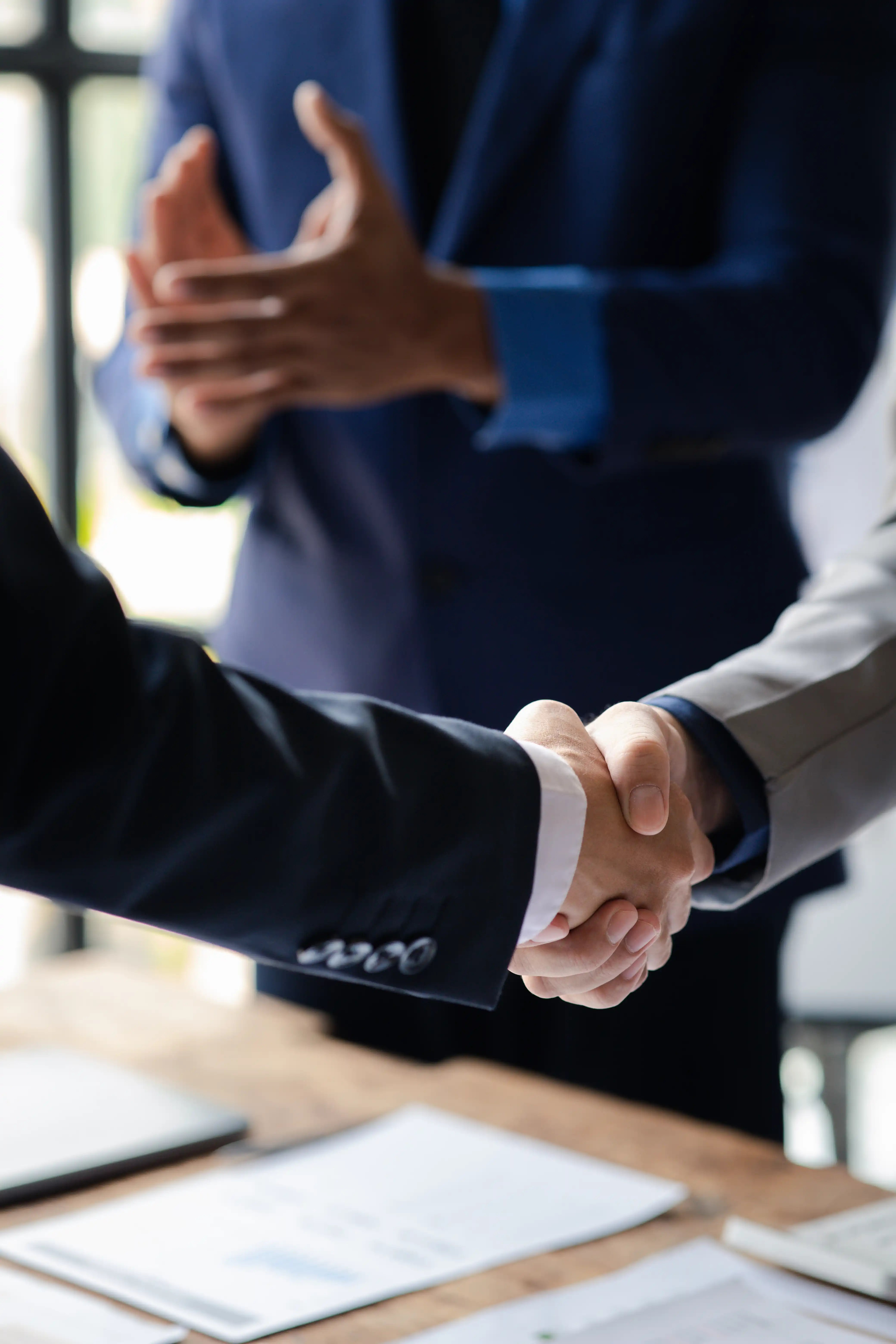 close-up-two-business-men-holding-hands-two-busin-2025-01-16-22-48-42-utc close-up-two-business-men-holding-hands-two-busin-2025-01-16-22-48-42-utc